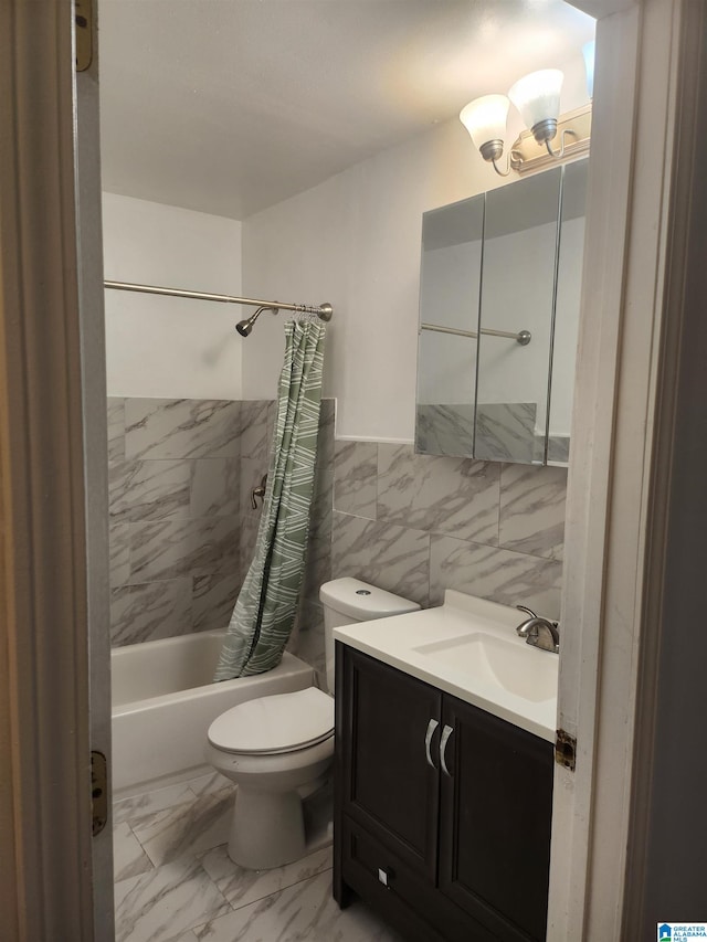 full bathroom with vanity, toilet, tile walls, and shower / bath combo with shower curtain