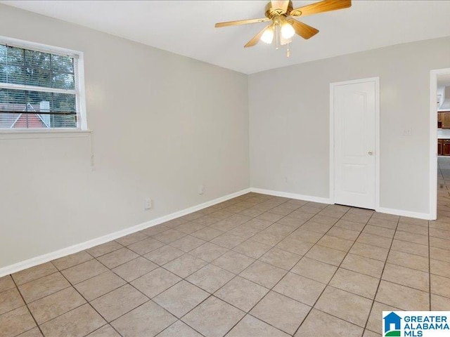 unfurnished room featuring light tile patterned flooring and ceiling fan