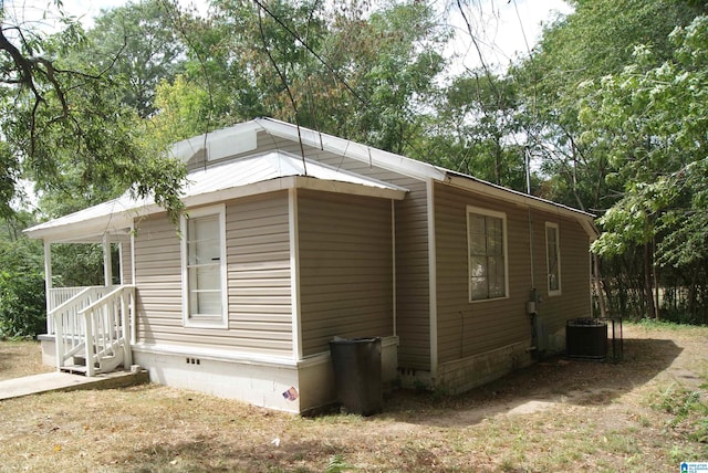 view of side of property with cooling unit