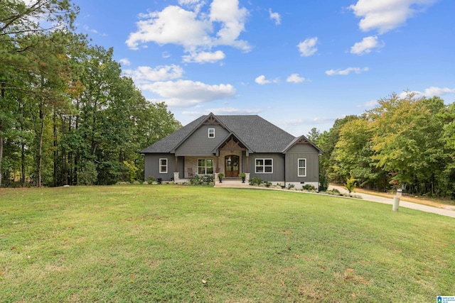 craftsman-style home featuring a front lawn