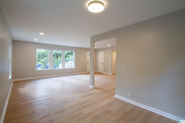 spare room featuring light hardwood / wood-style flooring