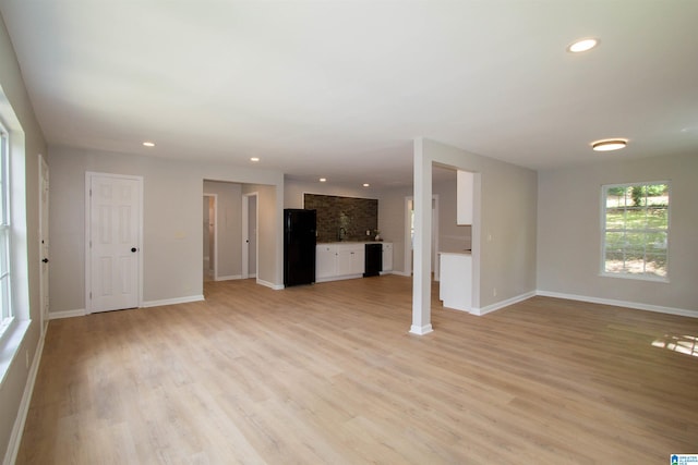 unfurnished living room featuring light hardwood / wood-style flooring