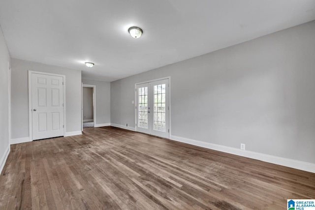 unfurnished room featuring hardwood / wood-style flooring and french doors