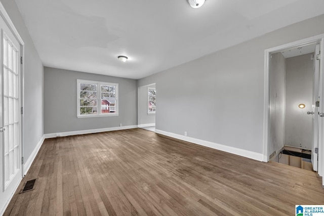 spare room featuring hardwood / wood-style flooring