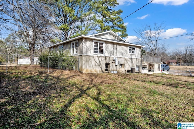 exterior space featuring a lawn and central AC