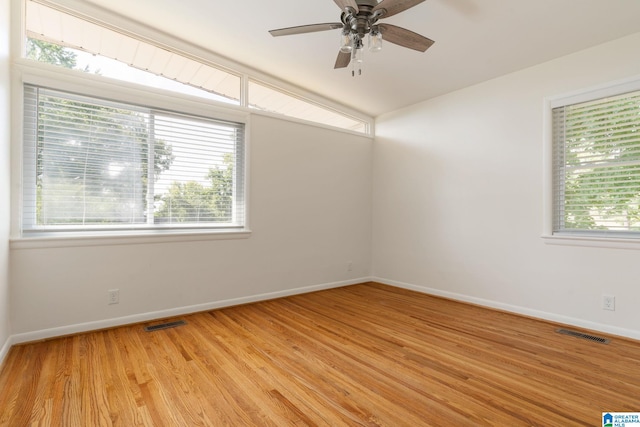 empty room featuring ceiling fan and light hardwood / wood-style floors