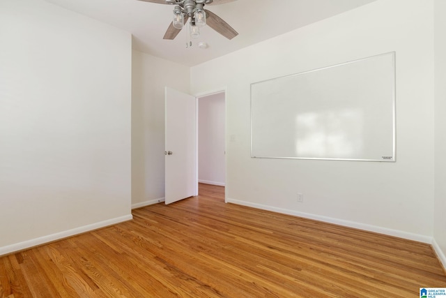 unfurnished room with ceiling fan and light hardwood / wood-style floors