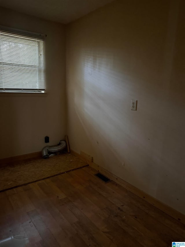 unfurnished room featuring hardwood / wood-style flooring