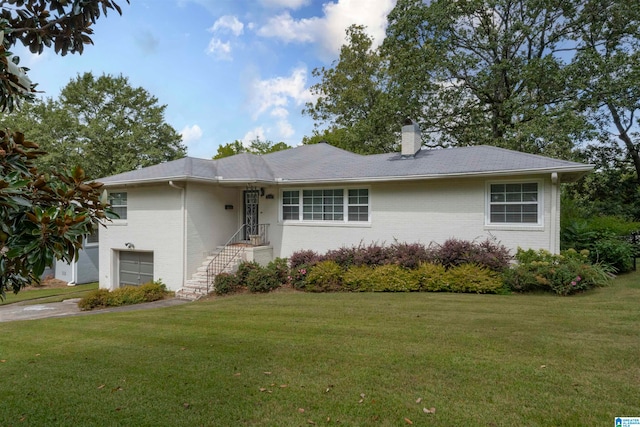 single story home with a garage and a front yard