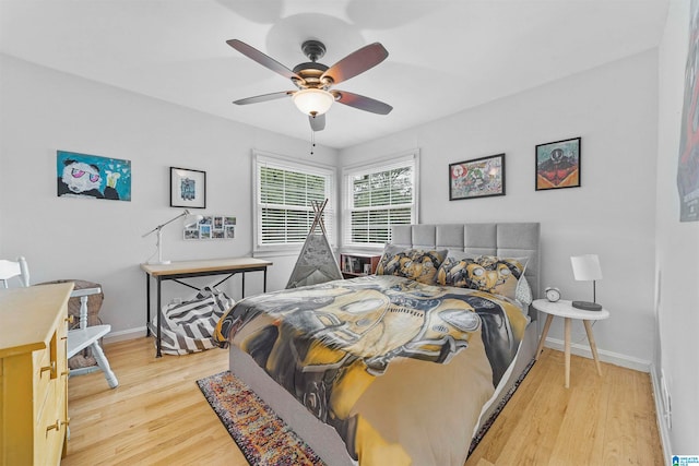 bedroom featuring light wood-type flooring and ceiling fan