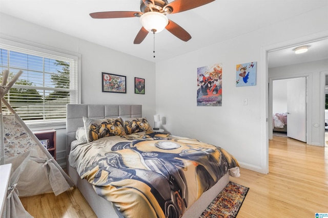 bedroom featuring ceiling fan and light hardwood / wood-style floors