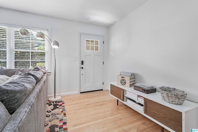 entryway with light hardwood / wood-style floors