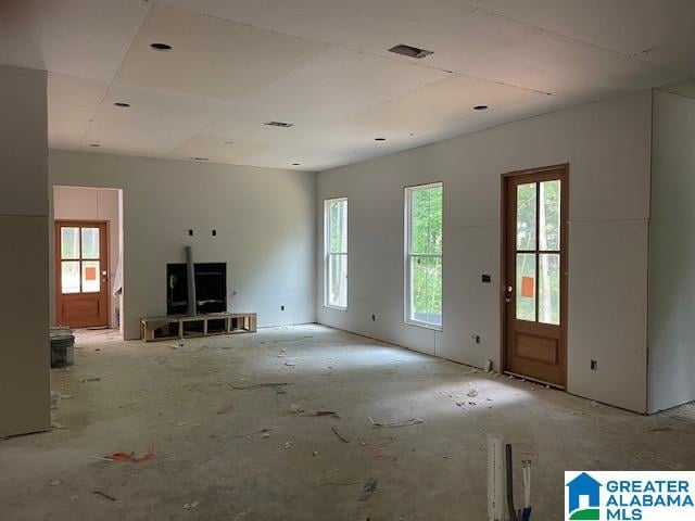 unfurnished living room with a healthy amount of sunlight