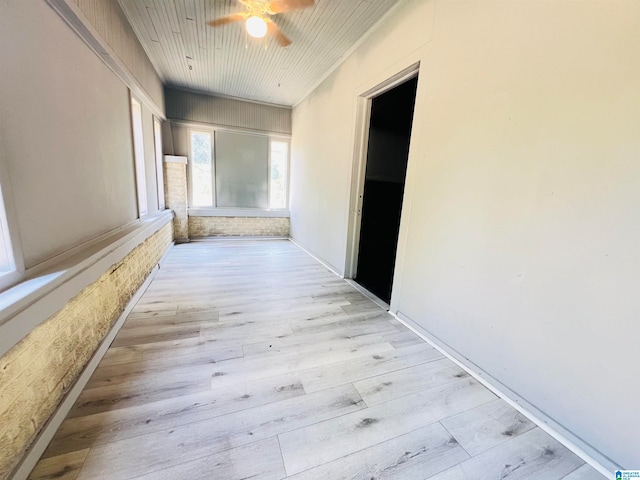 hall with wood ceiling and light wood-type flooring