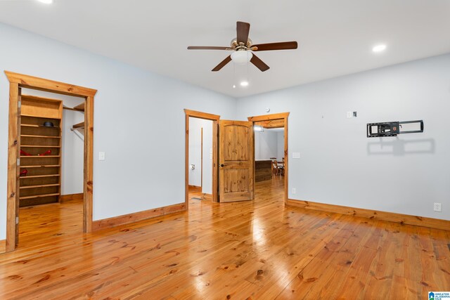 spare room featuring light hardwood / wood-style flooring and ceiling fan