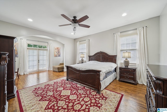 bedroom with french doors, ceiling fan, and hardwood / wood-style floors