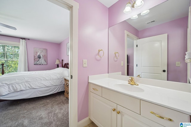 bathroom with ceiling fan and vanity