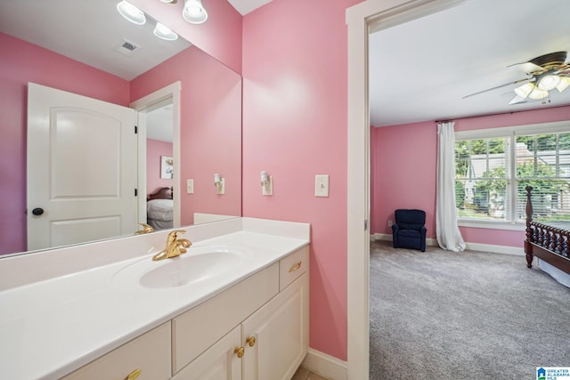 bathroom featuring ceiling fan and vanity