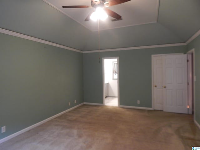 interior space with ceiling fan, ornamental molding, and carpet floors