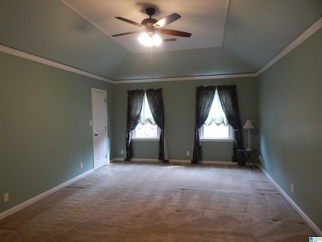 carpeted spare room with ceiling fan and ornamental molding