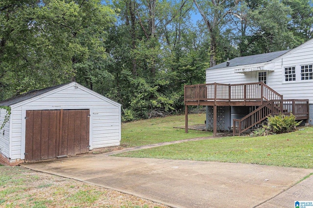 view of yard featuring a deck and a shed