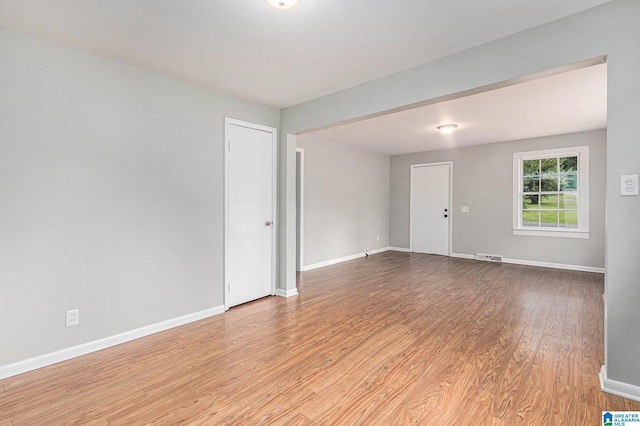 spare room with light hardwood / wood-style flooring