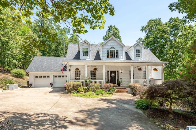 157 Hickory Ridge Dr, Glencoe, AL 35905 - new england style home featuring covered porch, concrete driveway, an attached garage, and a shingled roof