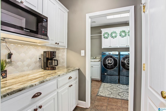 157 Hickory Ridge Dr, Glencoe, AL 35905 - laundry room featuring washing machine and dryer, cabinet space, and tile patterned floors