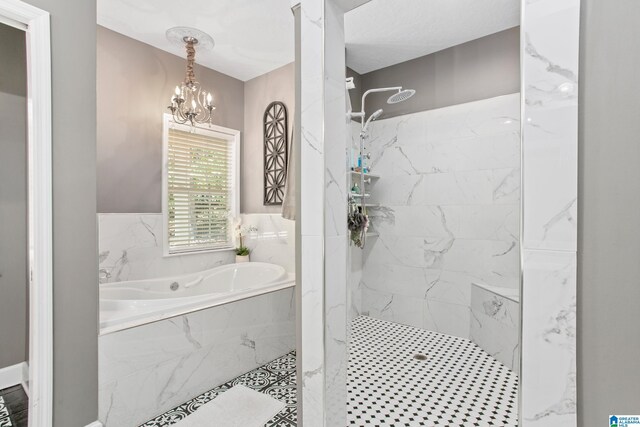 157 Hickory Ridge Dr, Glencoe, AL 35905 - full bathroom featuring a marble finish shower, a bath, and a chandelier