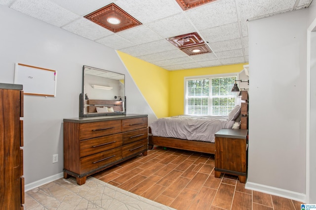 157 Hickory Ridge Dr, Glencoe, AL 35905 - bedroom featuring baseboards, a paneled ceiling, and wood finished floors