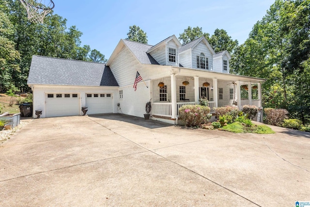 157 Hickory Ridge Dr, Glencoe, AL 35905 - cape cod house with covered porch, driveway, a garage, and a shingled roof
