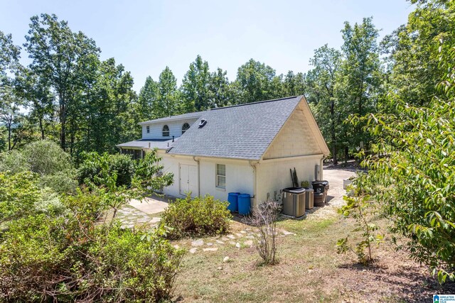 157 Hickory Ridge Dr, Glencoe, AL 35905 - rear view of property featuring stucco siding, a shingled roof, and a patio