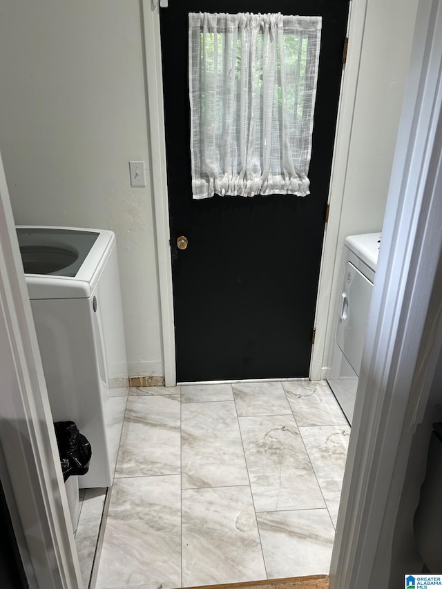 laundry area with independent washer and dryer