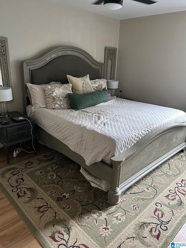 bedroom featuring ceiling fan and hardwood / wood-style floors