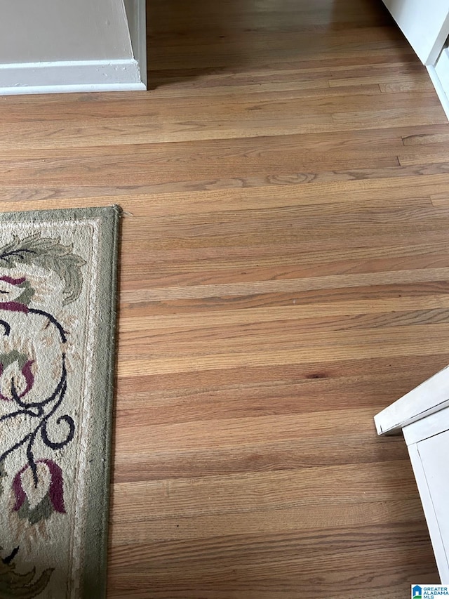 interior details featuring hardwood / wood-style flooring