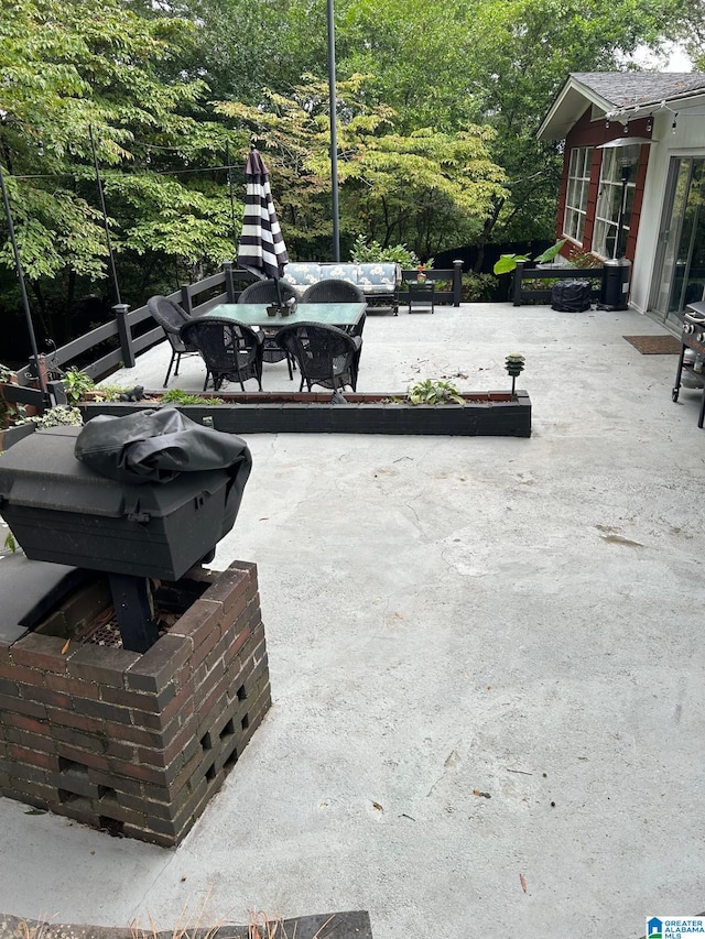 view of patio featuring a grill