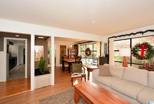 living room featuring a notable chandelier