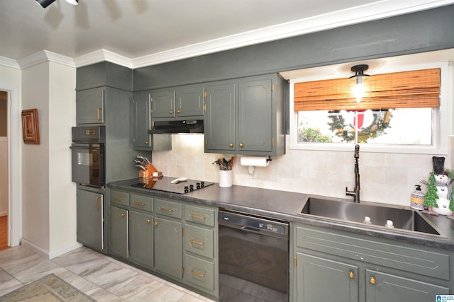 kitchen featuring crown molding, decorative backsplash, sink, and black appliances