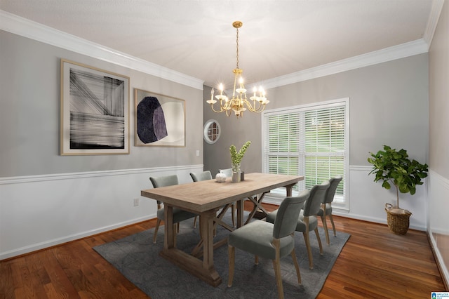 dining room with crown molding, dark hardwood / wood-style flooring, and a notable chandelier