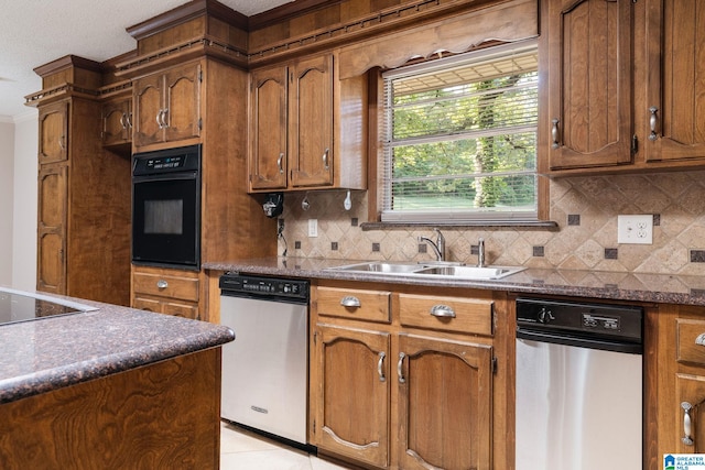 kitchen with light tile patterned flooring, sink, tasteful backsplash, and black appliances