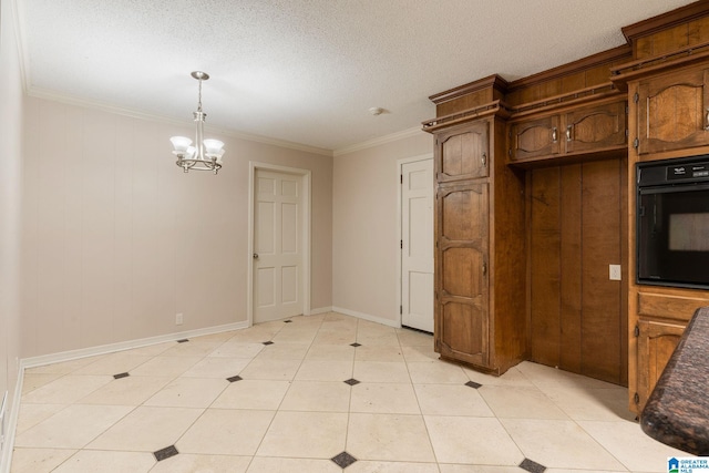 kitchen featuring a chandelier, a textured ceiling, black oven, and light tile patterned floors