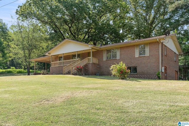 single story home featuring an attached carport, brick siding, a front lawn, and covered porch