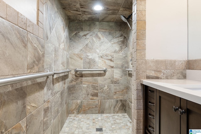 full bathroom with a stall shower, recessed lighting, and vanity