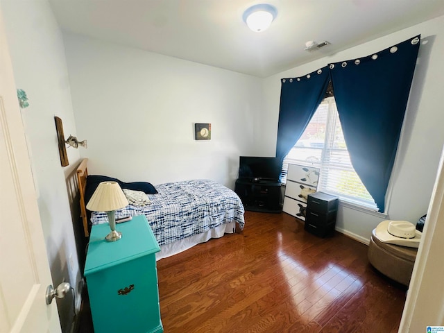 bedroom featuring dark hardwood / wood-style floors