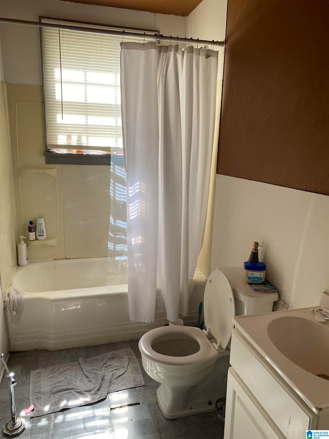 full bathroom featuring toilet, vanity, and shower / tub combo