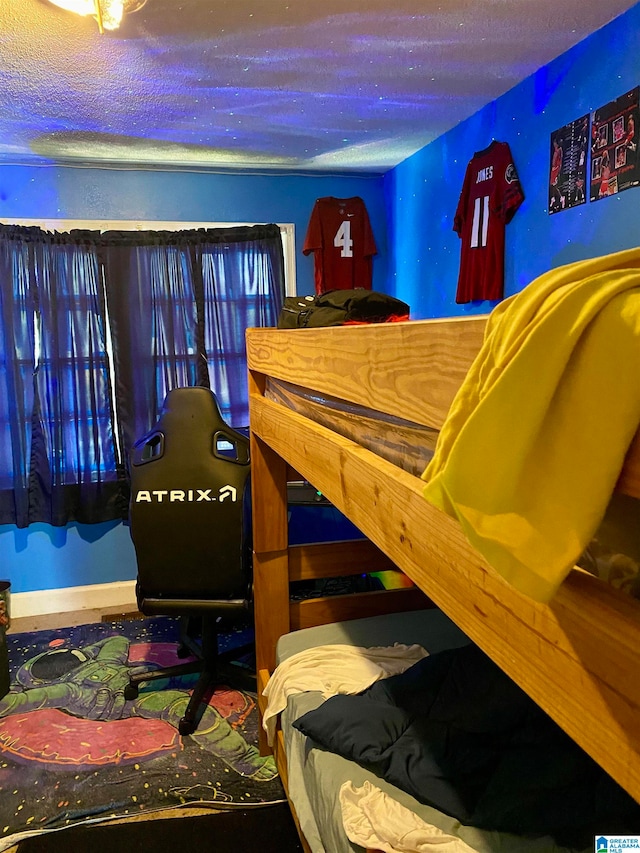 bedroom featuring a textured ceiling