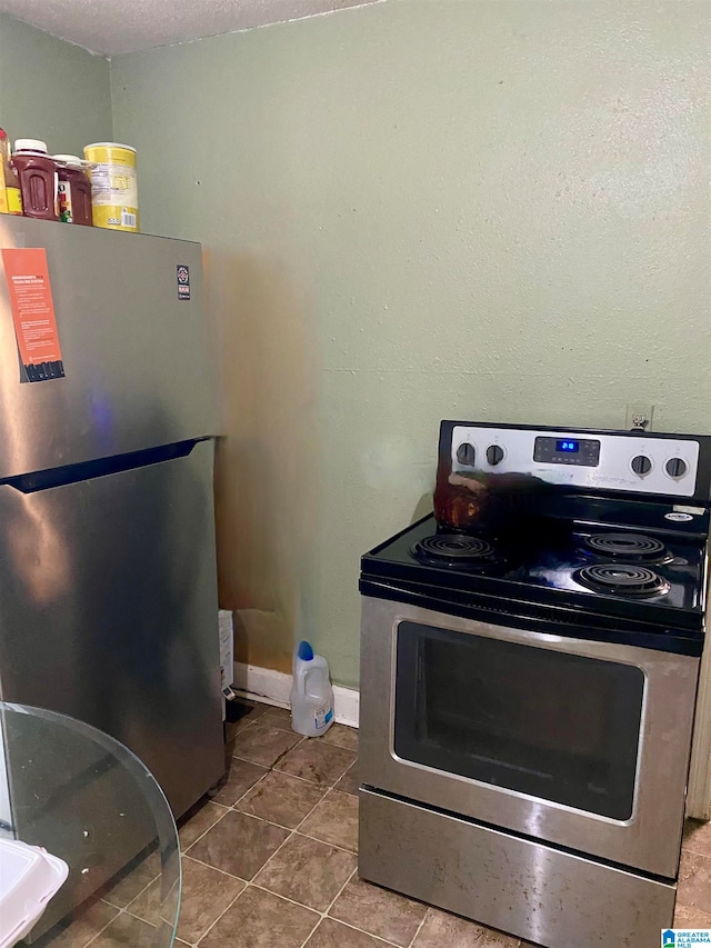 kitchen featuring appliances with stainless steel finishes and tile patterned floors