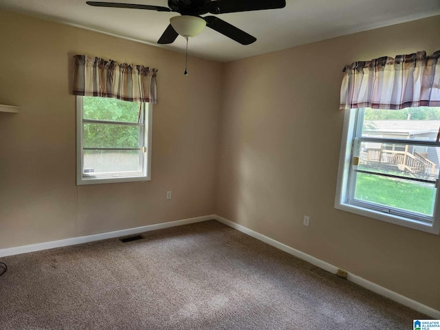 empty room featuring carpet and ceiling fan