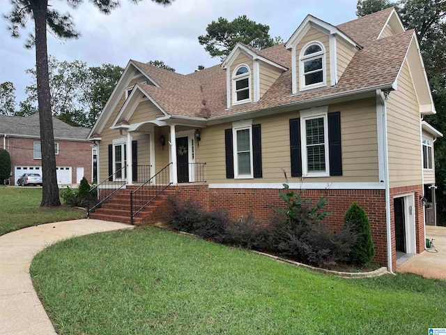 view of front of home featuring a front yard and a garage