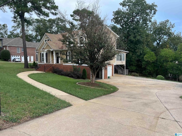 view of front of house with a garage and a front yard